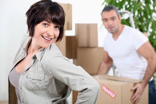 Professional removal team loading items into a truck.