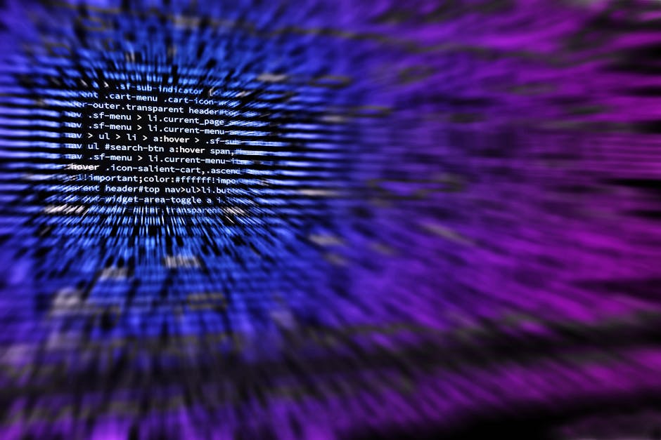 A close-up view of a computer screen displaying lines of HTML code, with a black background and with part of the code highlighted in white and blue. The screen has a flickering, pixelated effect, crea